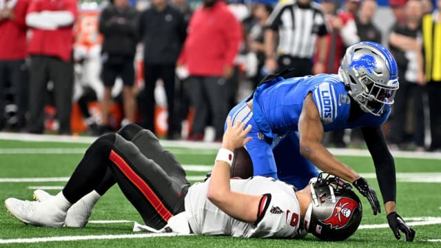 Detroit Lions safety Ifeatu Melifonwu sacks Baker Mayfield.